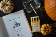 White Printer Paper Beside Yellow and White Cigarette Pack