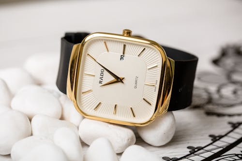 Free Gold Wristwatch with a Black Strap Stock Photo