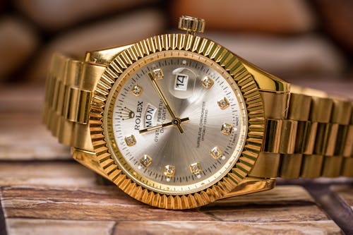 Free A Gold Rolex Analog Watch Stock Photo