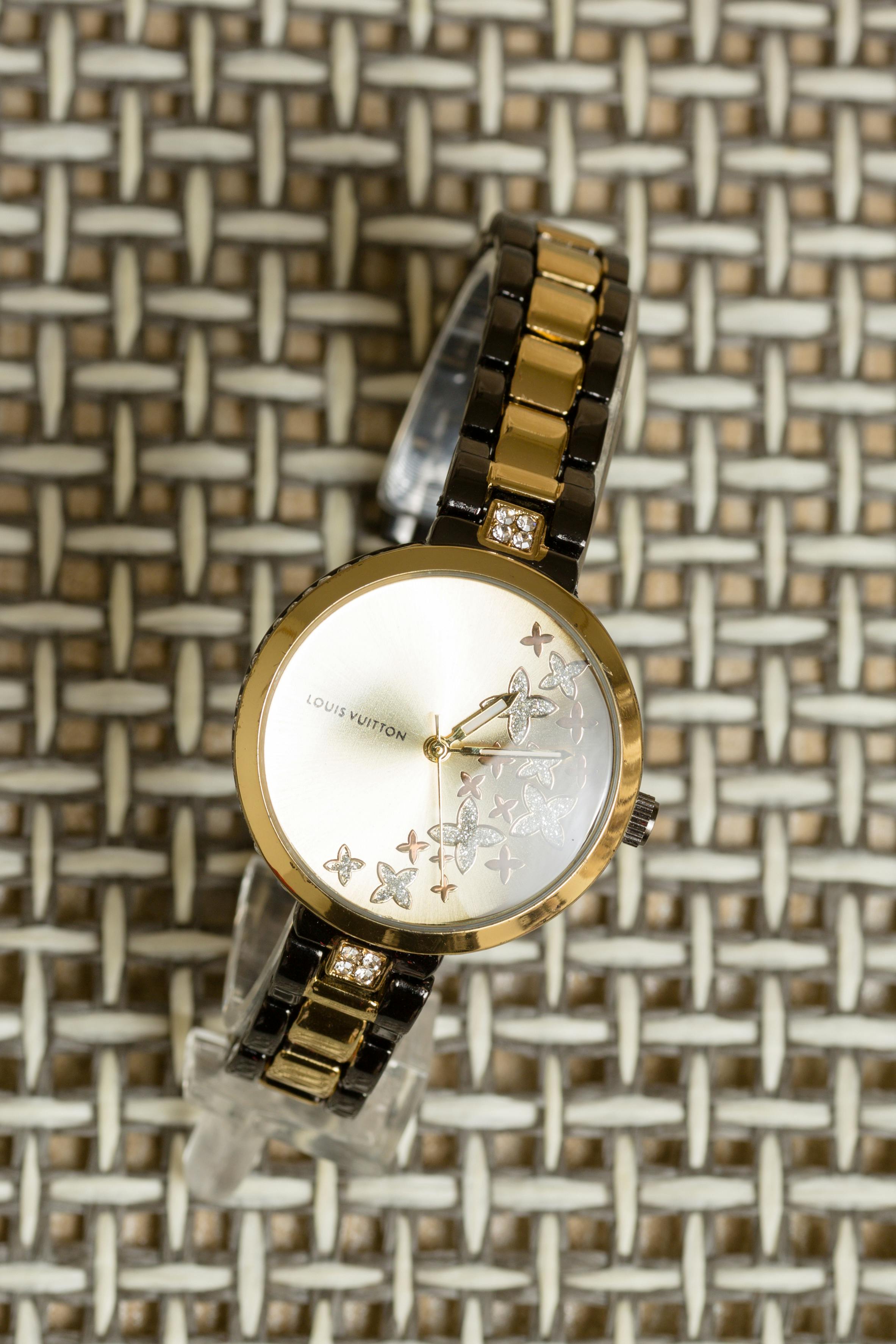 louis vuitton gold and silver analog watch