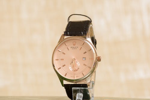 Free Elegant Rolex Watch with Brown Leather Strap  Stock Photo