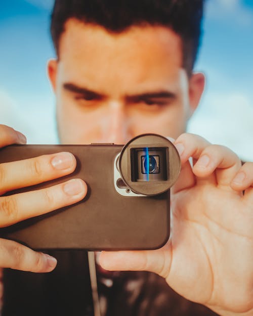 Person Taking Photo Using a Smartphone 