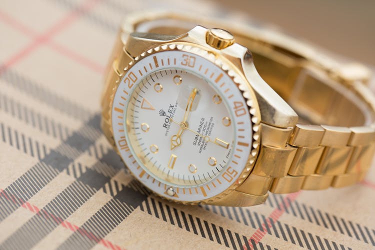 Close-up Of A Gold Rolex Wristwatch