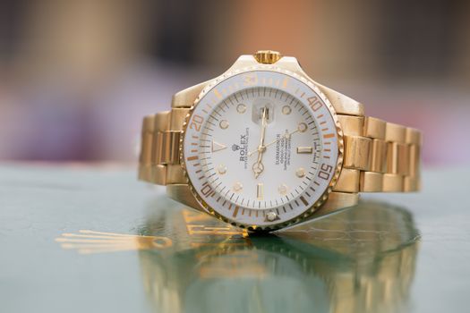 Gold and White Analog Watch at 10 00