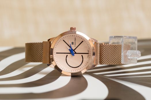 Gold and Blue Analog Watch at 10 10