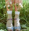 Girl in Sandals with Flowers in Socks