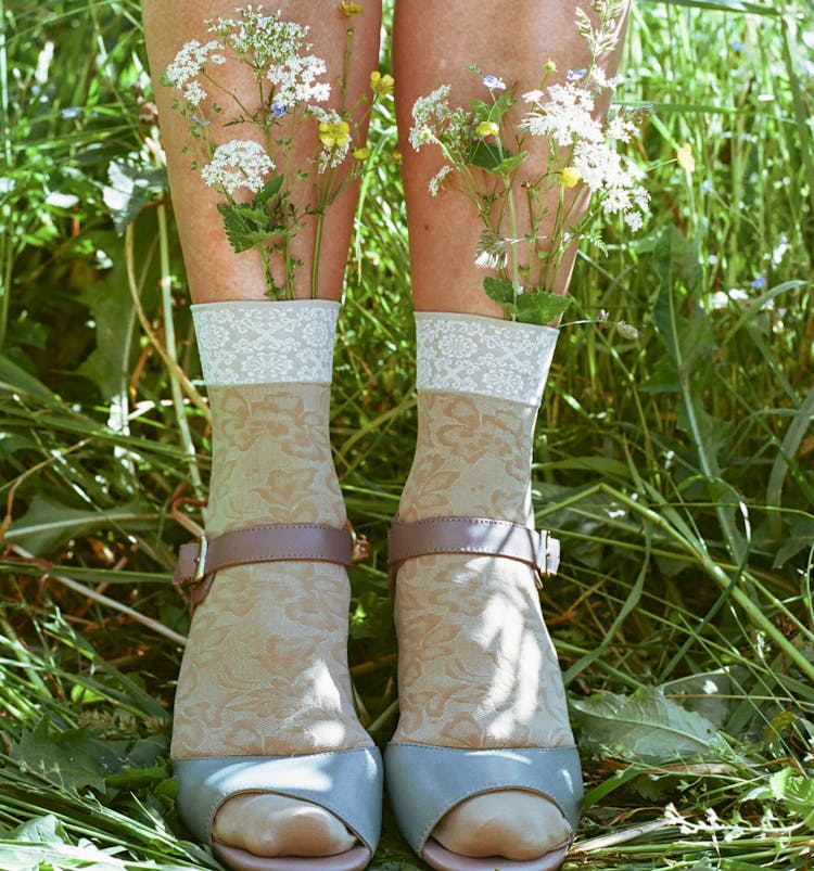 Girl In Sandals With Flowers In Socks