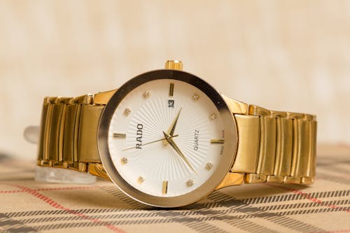 Free Gold Rado Watch with White Clock Face Stock Photo