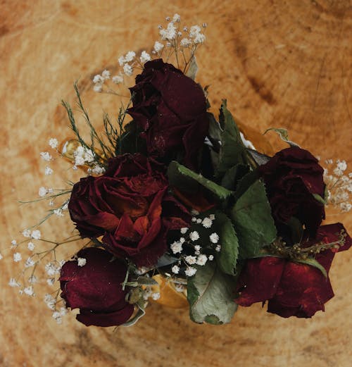 Dried Roses in Wooden Surface 