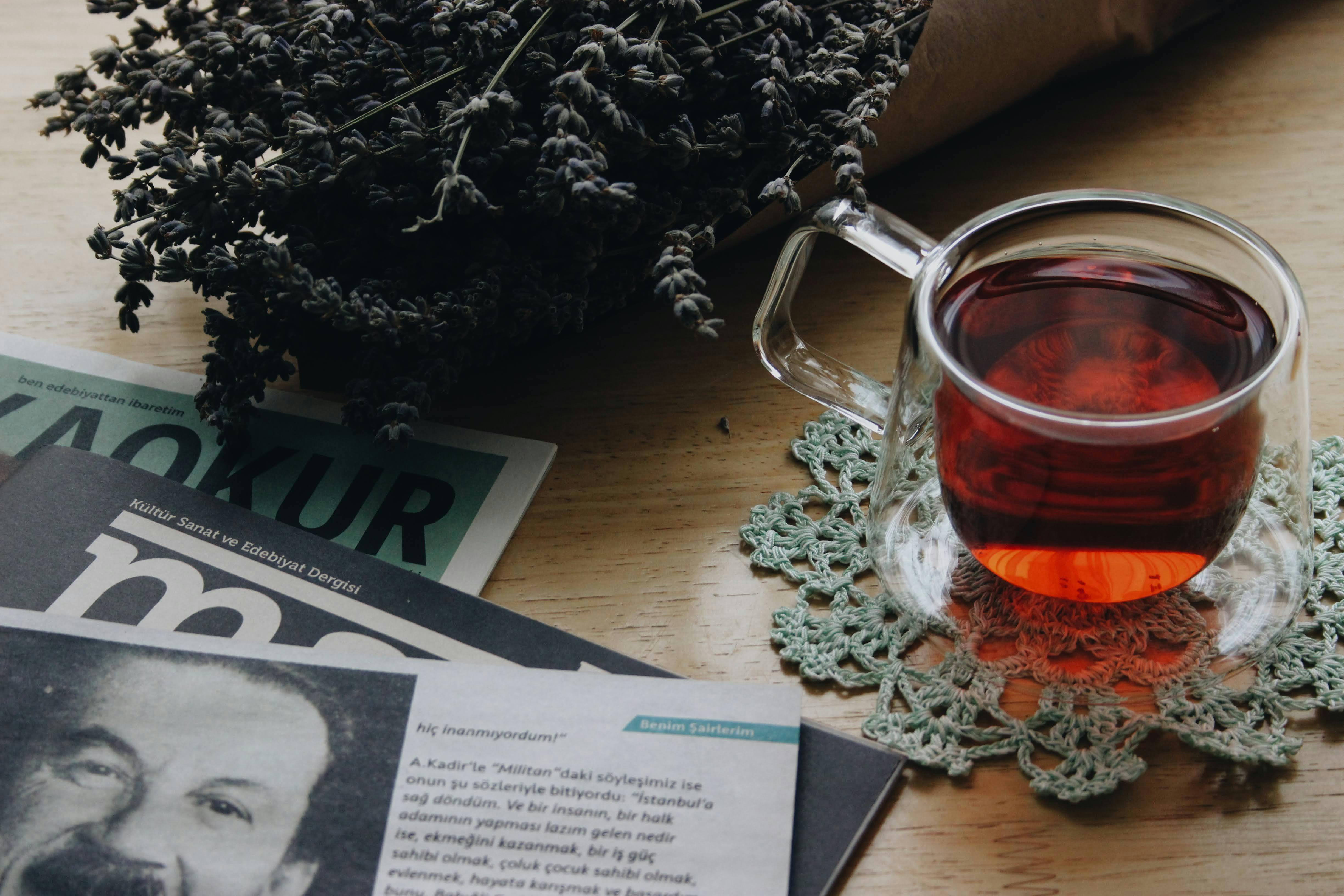 A Cup of Tea Near Magazines · Free Stock Photo