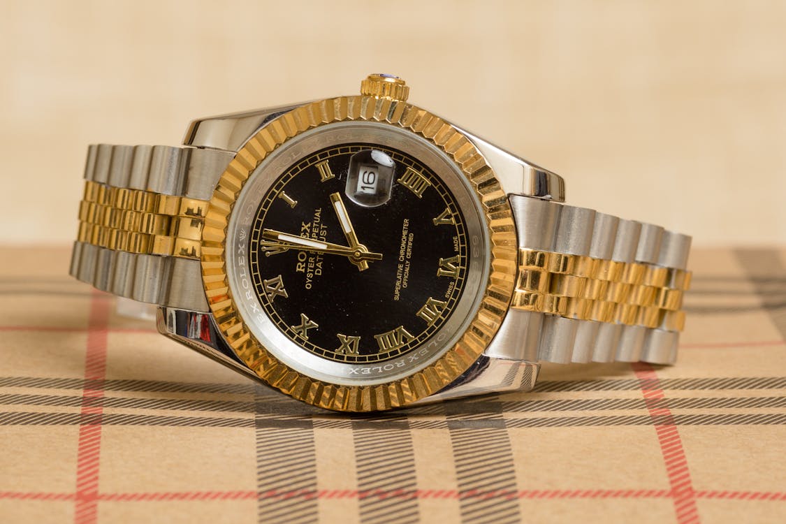 Free Close-Up Photo of a Silver and Gold Wristwatch Stock Photo
