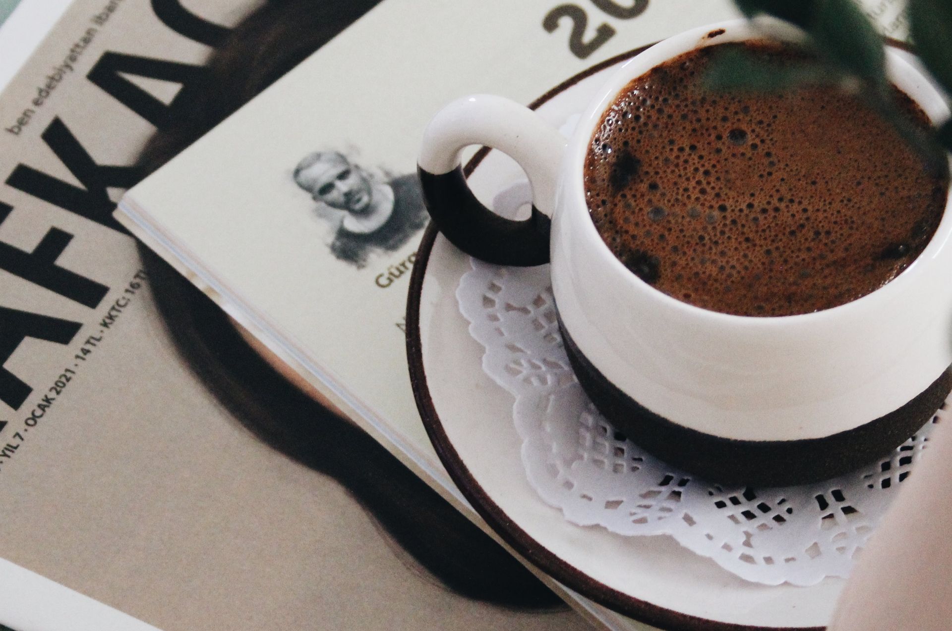 Cozy setting with a cup of coffee and Kafka book for a perfect morning read.