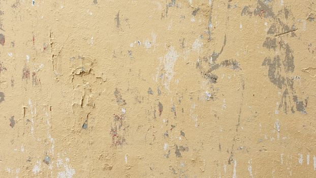 High-resolution image of a textured, grunge-style beige wall surface, ideal for backgrounds.