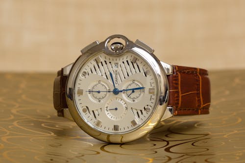 Free Round Silver Chronograph Watch With Brown Leather Strap Stock Photo
