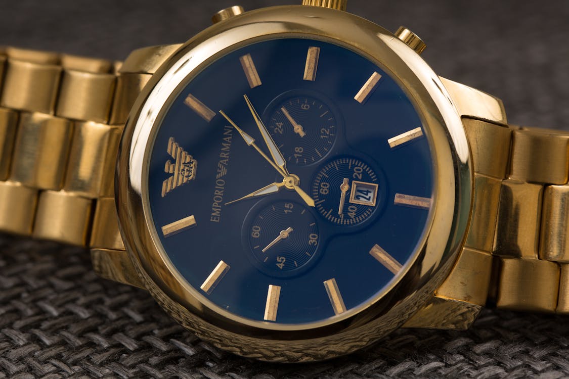 Free Golde Wristwatch of Luxury Brand Stock Photo