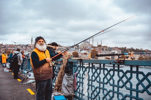 Angler Fishing on Bridge 