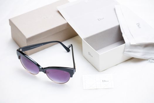 Black Framed Sunglasses Beside the Box
