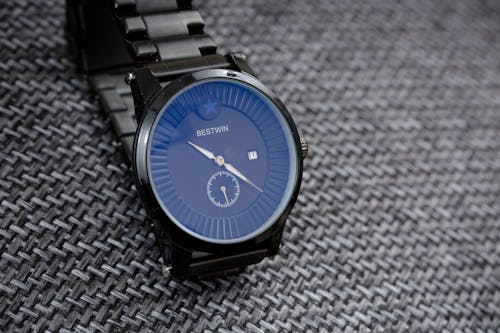 Free Black Wristwatch on Gray Surface Stock Photo