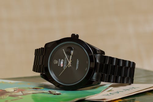Close-up Photo of a Black Rolex Wristwatch