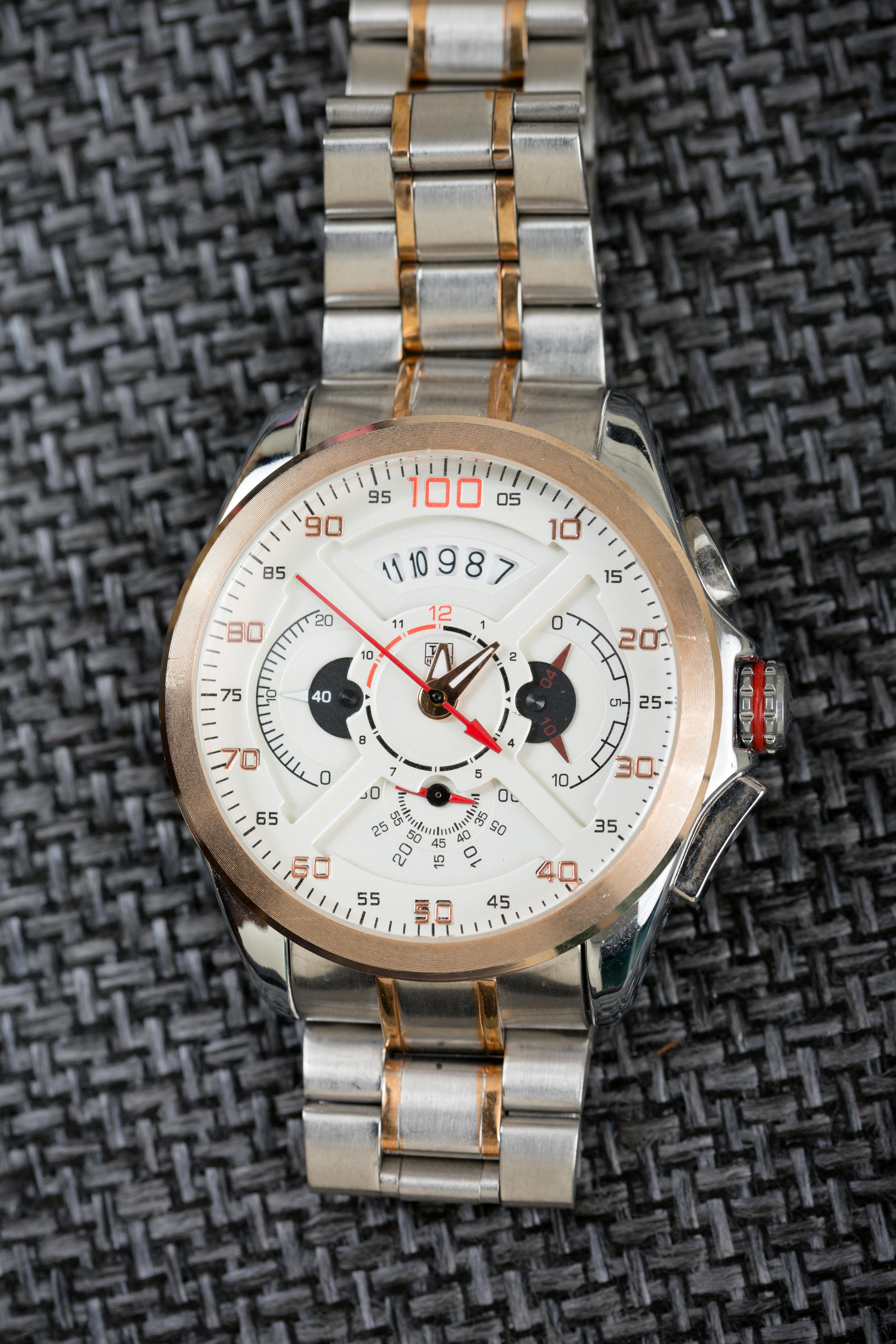 silver and gold round chronograph watch