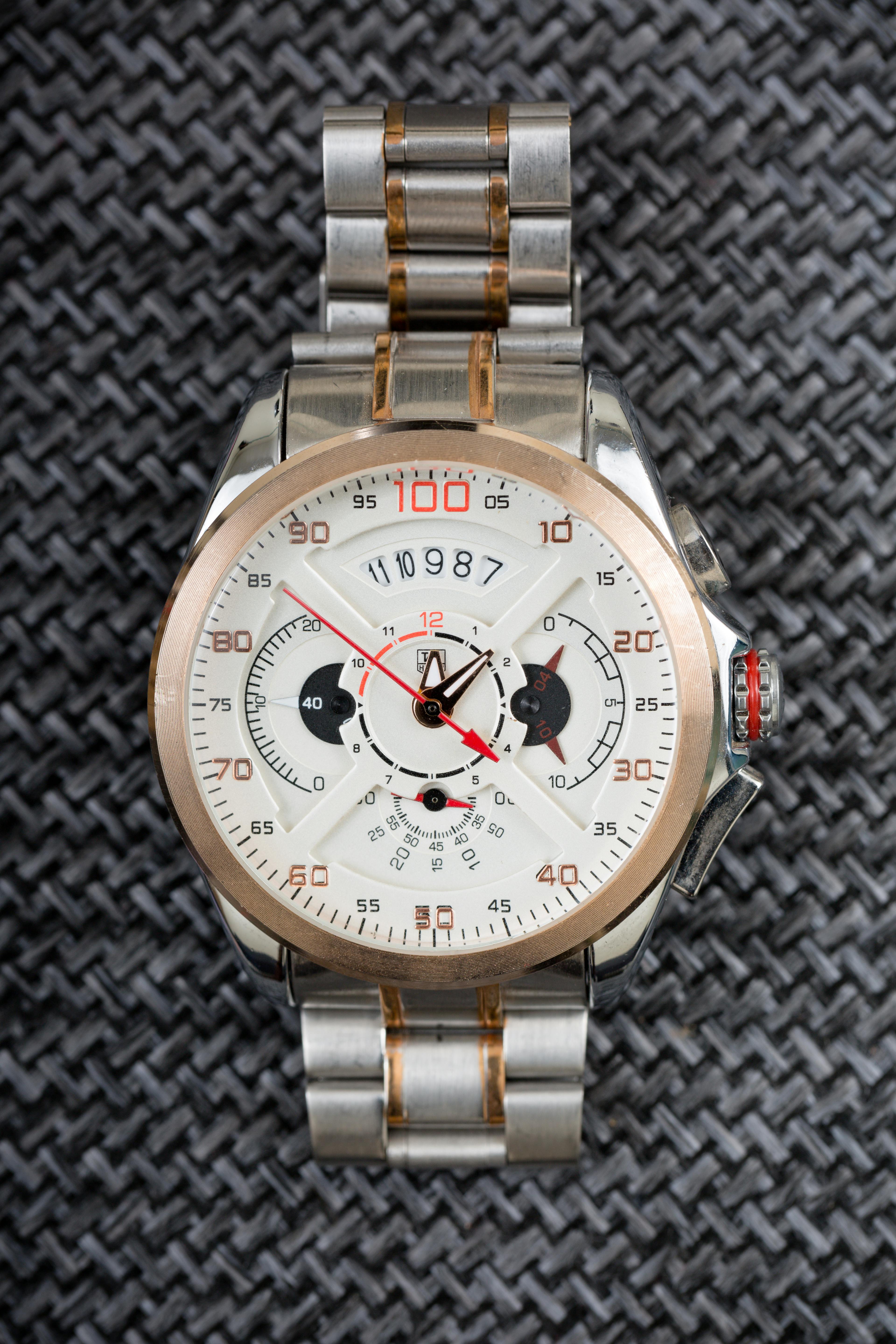 silver and gold round chronograph watch