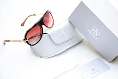 Free White Leather Case and  a Mercedes-Benz Sunglasses Stock Photo