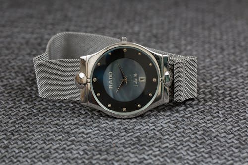 Gray Wristwatch on Gray Surface