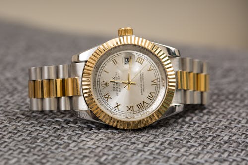 Close-Up Shot of Gold and Silver Watch