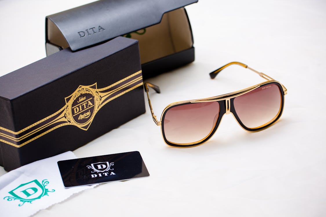 Black Leather Case and DITA Sunglasses · Free Stock Photo
