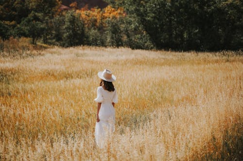 Rear View of Woman Standing in Field