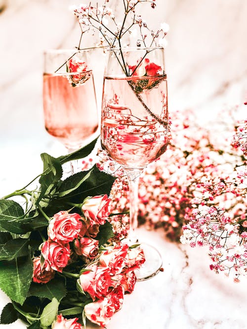 Pink Roses in Clear Wine Glasses