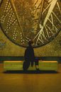 Man Sitting on Bench Astride 