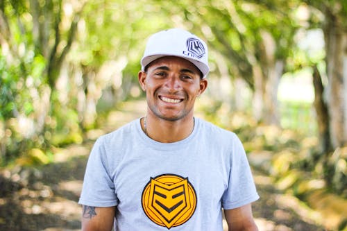 Portrait of Smiling Man in Baseball Cap