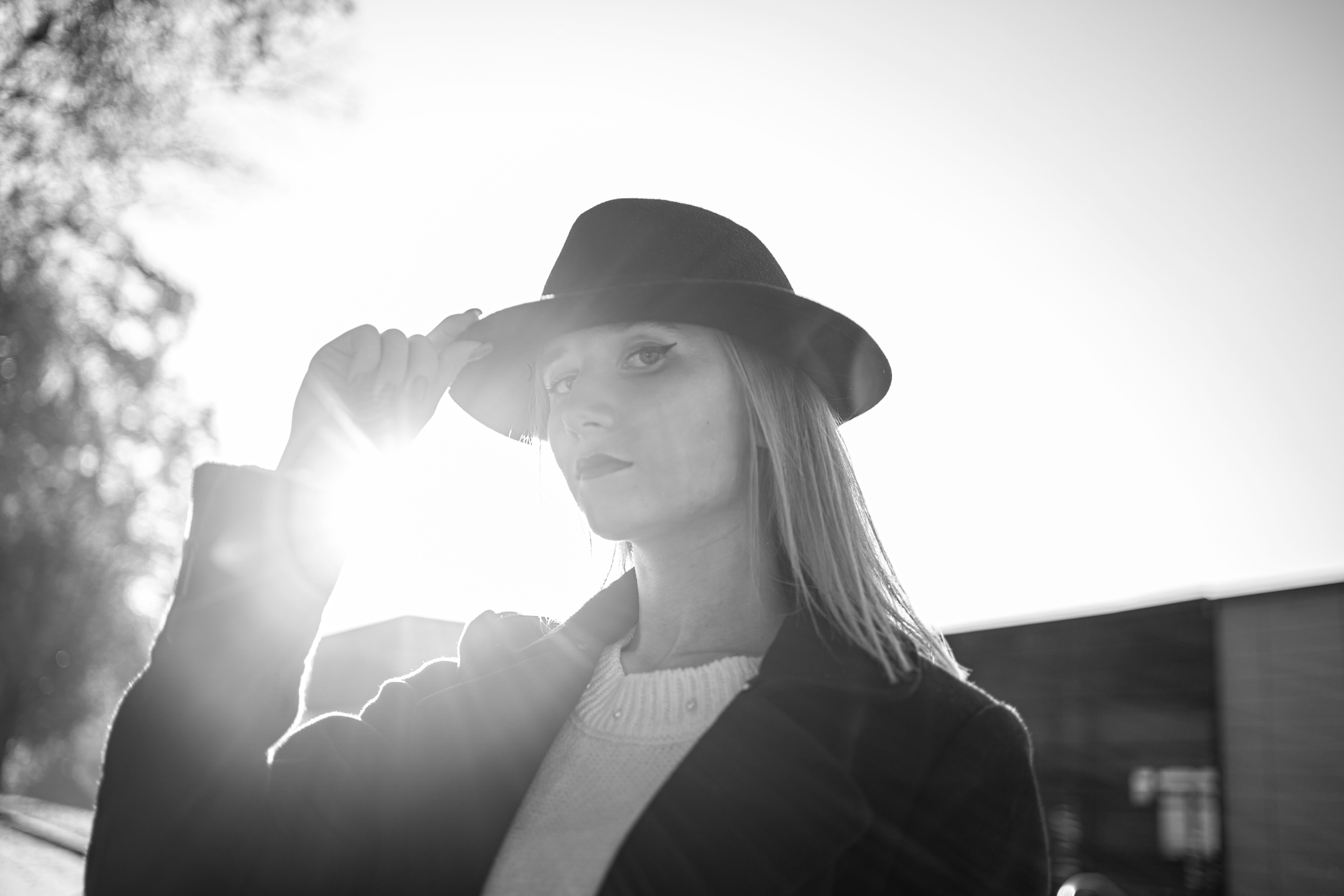 Silhouette of a Woman Wearing Hat · Free Stock Photo