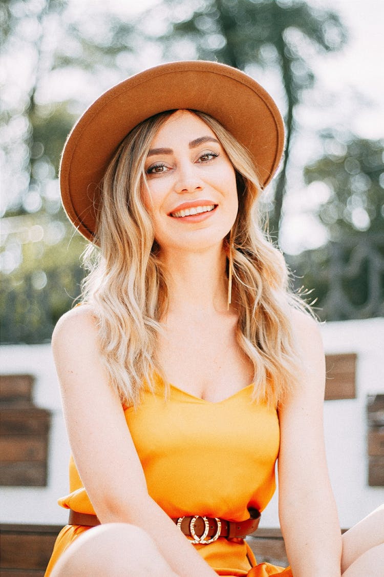 Blond Woman Wearing Yellow Dress And Hat