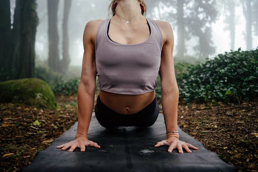 Yoga pose in a serene misty forest setting, enhancing mindfulness and connection with nature.
