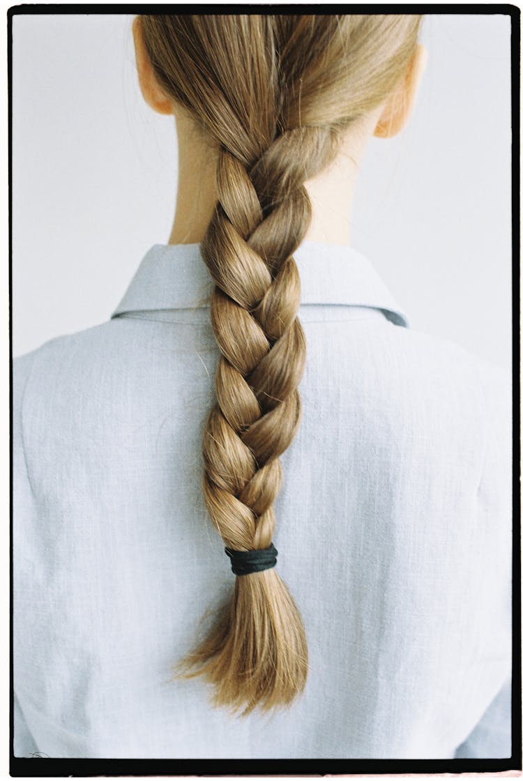 Woman In White Shirt With Braid