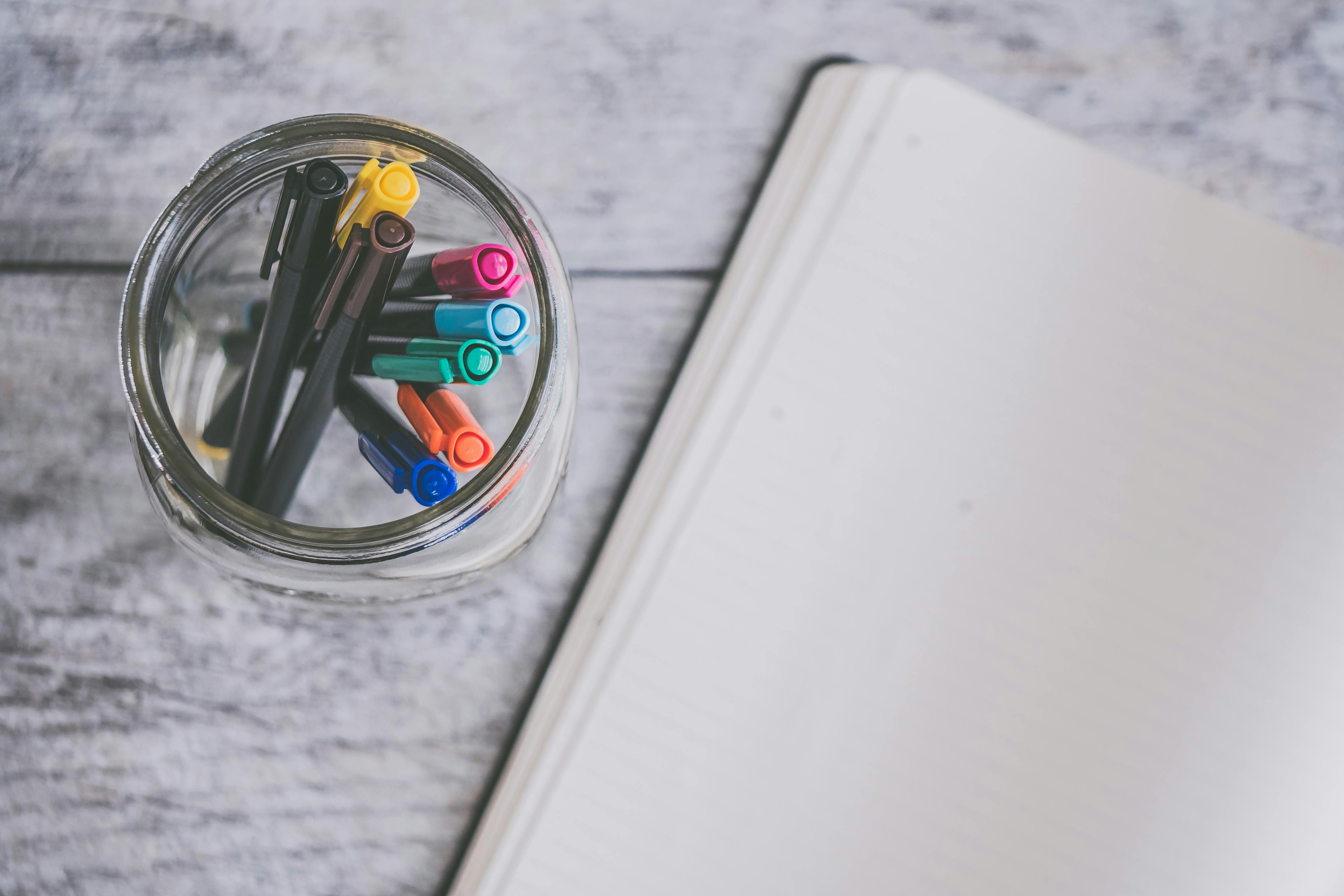 Closeup Photo of Journal Book and Pencils · Free Stock Photo