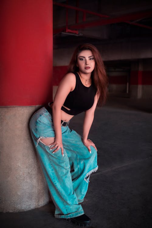 Beautiful Woman in Black Crop Top and Denim Jeans