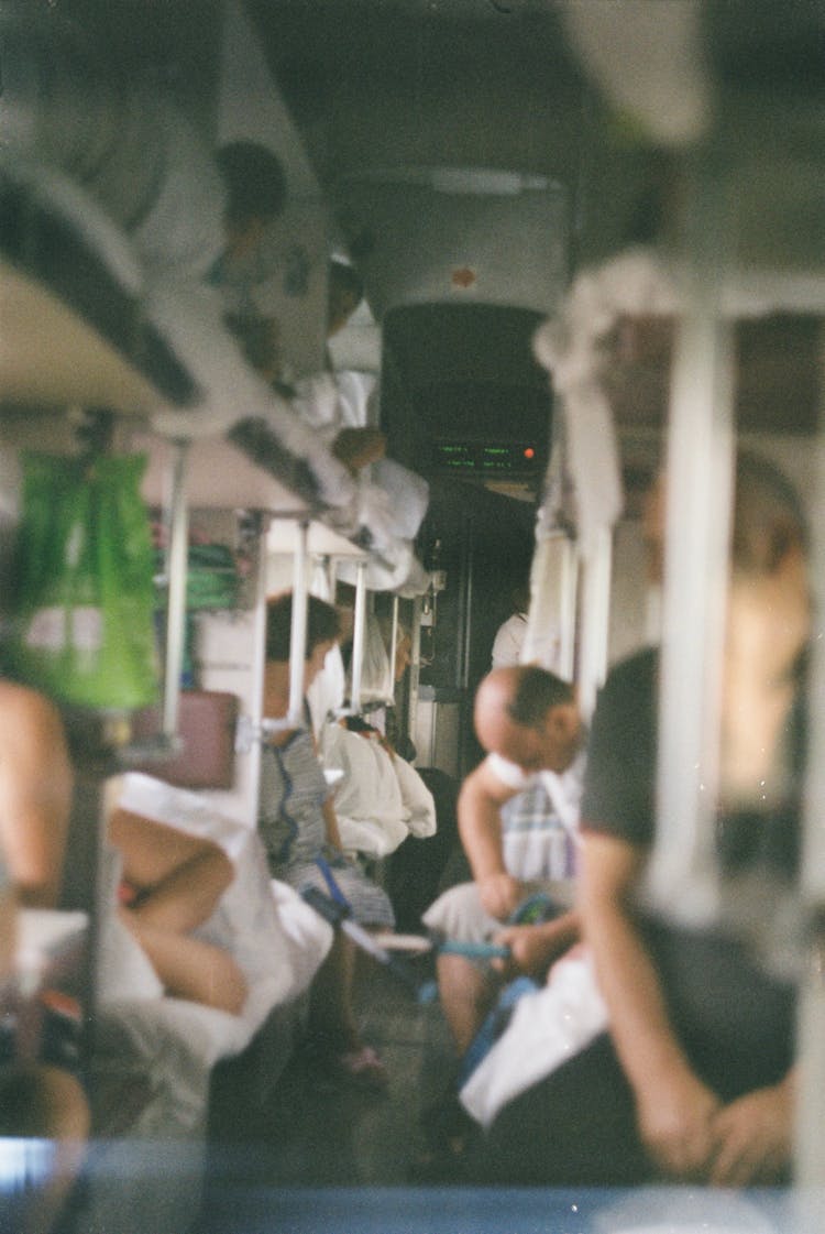 Blurry Photograph Of People In Crowded Train