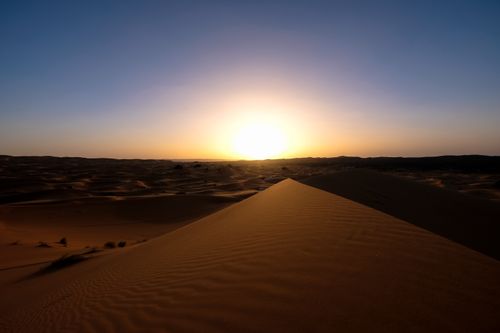 Free Beautiful sunset landscape over the sand dunes of Ksar Tanamouste, Morocco. Stock Photo
