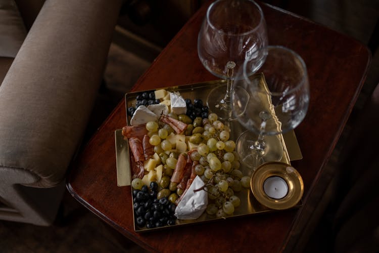 Grapes And Empty Wine Glasses On Tray