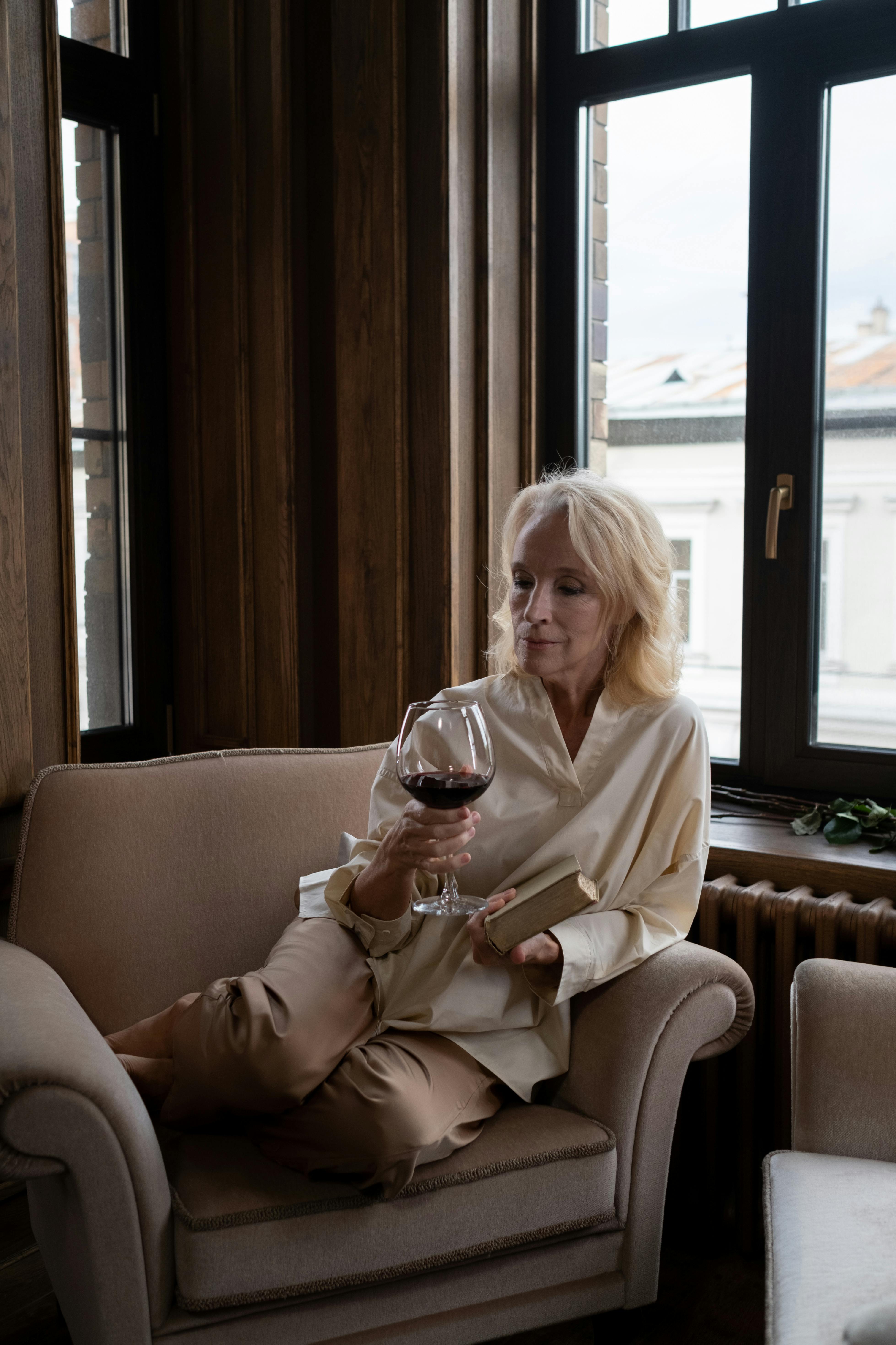 woman holding glass of wine