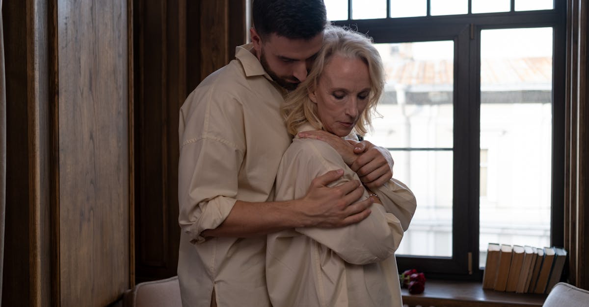 Physical Scene Of A Man Comforting A Woman In A Cozy Home Setting, Conveying Feelings Of Safety And Security