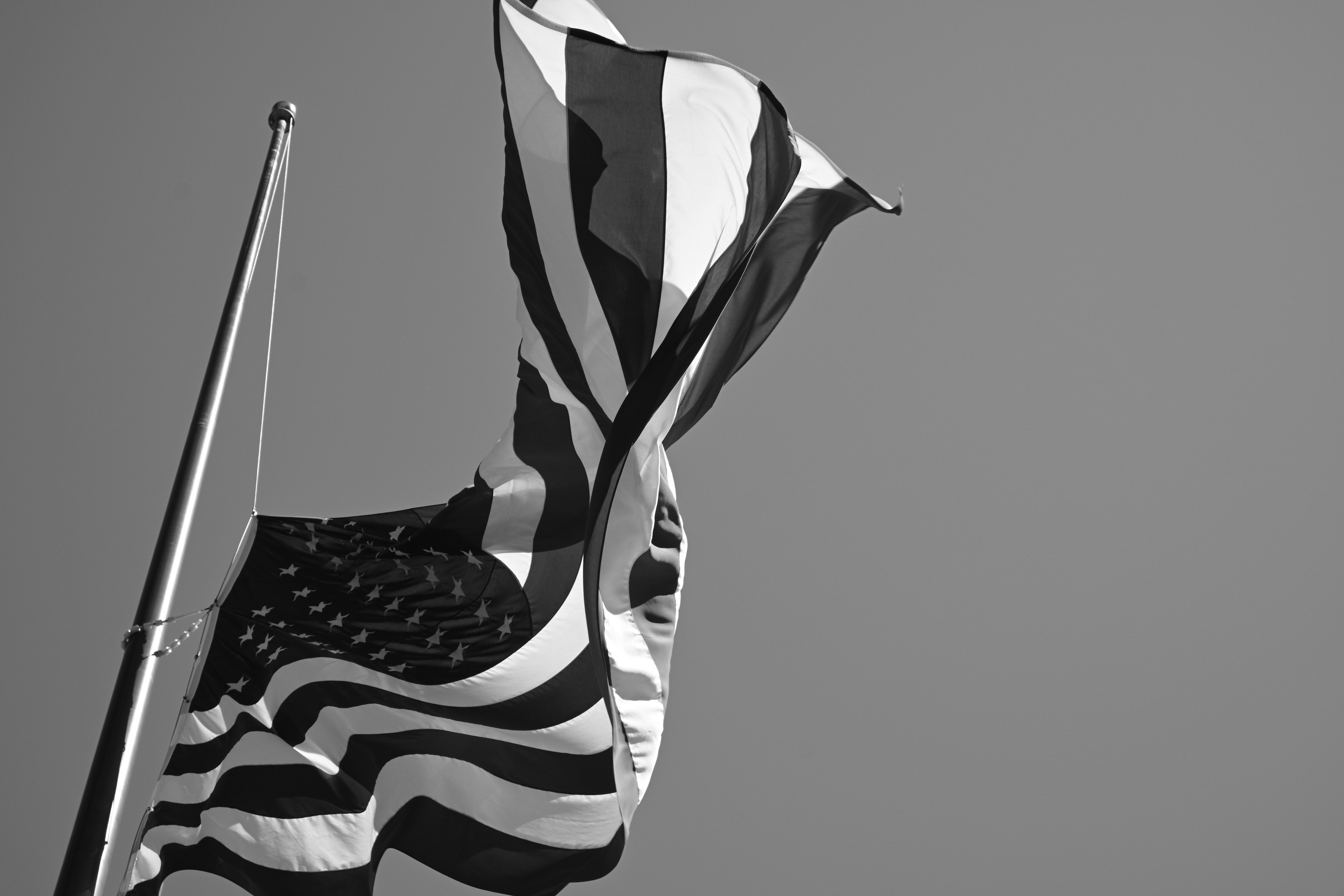 American Flag Hanging On Wooden Fence · Free Stock Photo