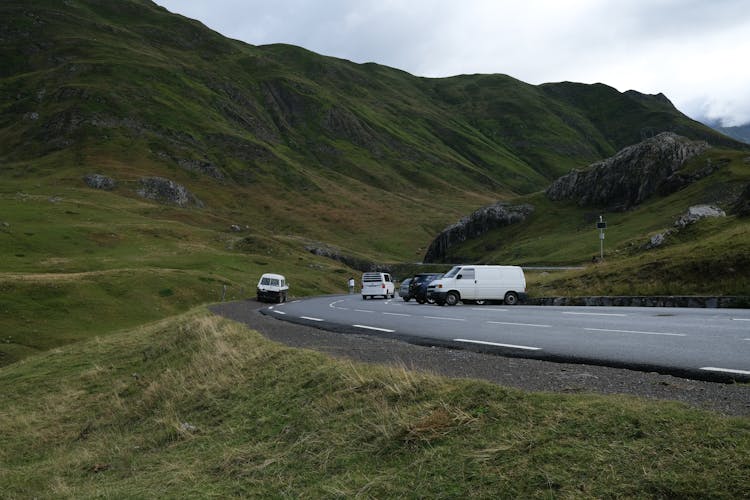 White Vans Parked A Road In Highlands 