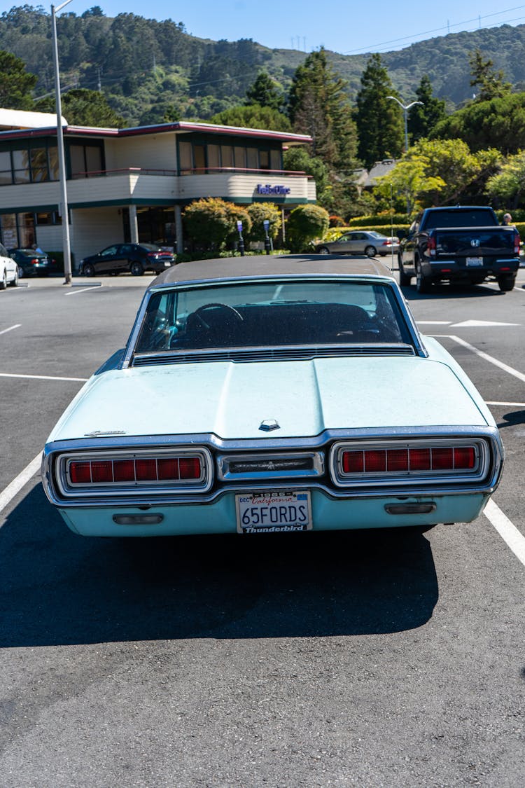 Rear View Of A Classic Car In A Parking Lot