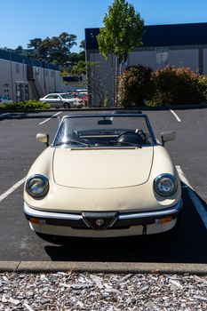 White Convertible Car Parked on Parking Space