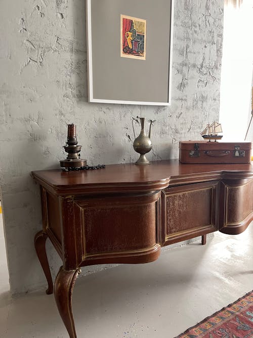 A Wooden Table with Vintage Objects on Top