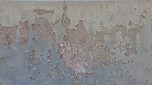 Cracked Paint on Concrete Wall